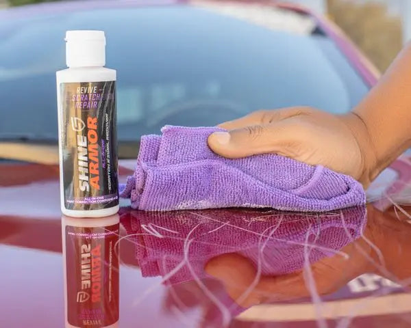 
              Person using Shine Armor Revive scratch remover.